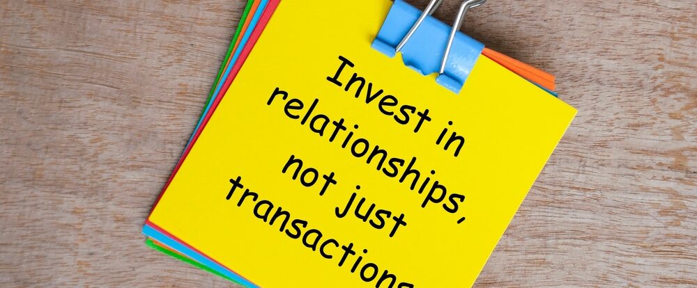 Invest,In,Relationships,,Not,Just,Transactions,Text,On,Yellow,Notepad.